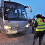 What is the Law on Seatbelts in Buses and who are responsible for passengers wearing seatbelts?