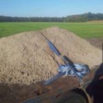 Is it compulsory for a tipper truck that is carrying soil material on it to have a tarp on it? 